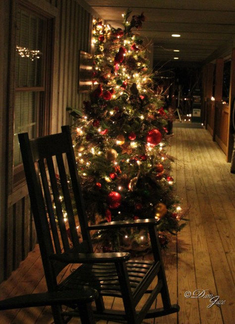 Christmas Tree on porch with rocking chair