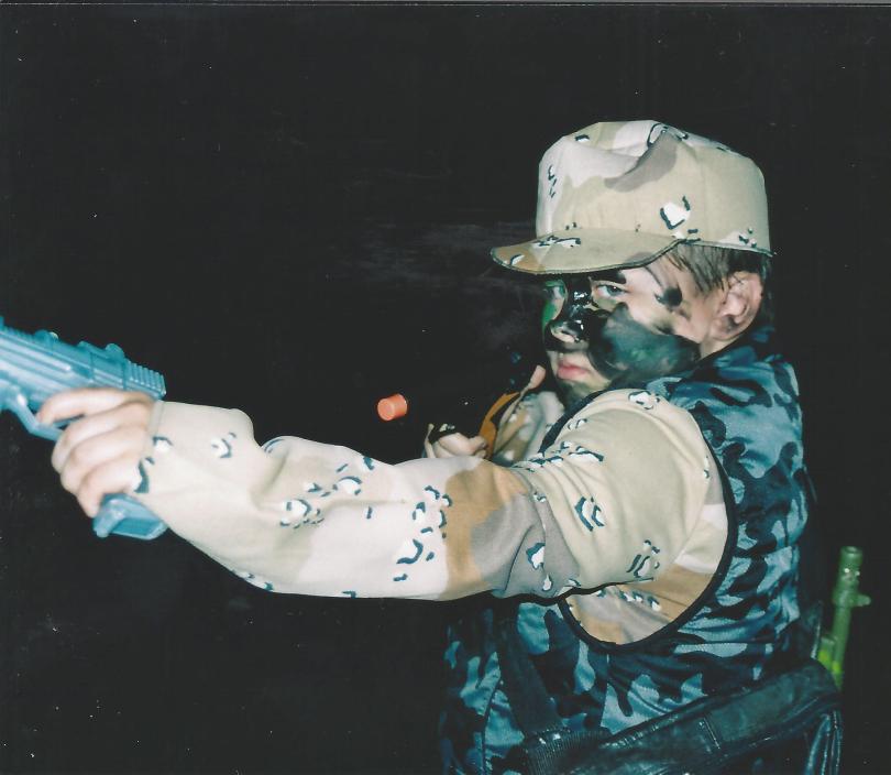 Child dressed in desert camo as a soldier